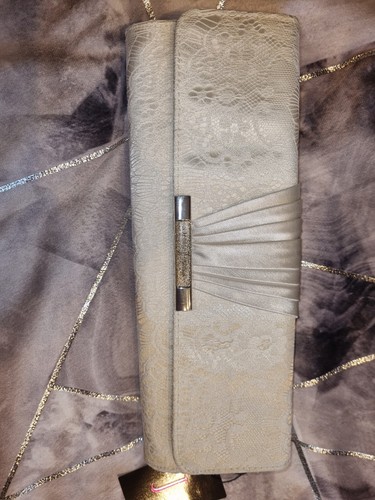 Clutch over shoulder handbag